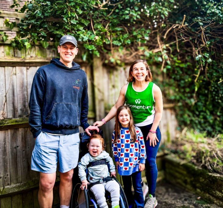 A dad, young son, daughter and mother standing outside as mother prepares to take on London Marathon.