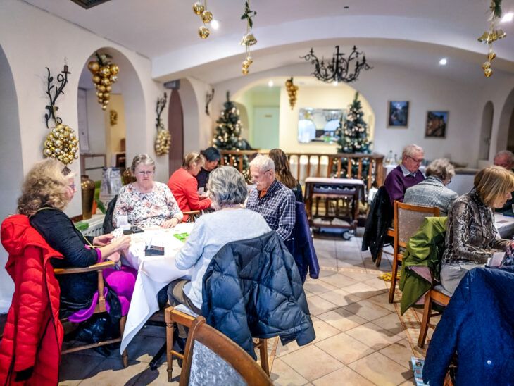 Bridge players gather for a day of games and refreshments.