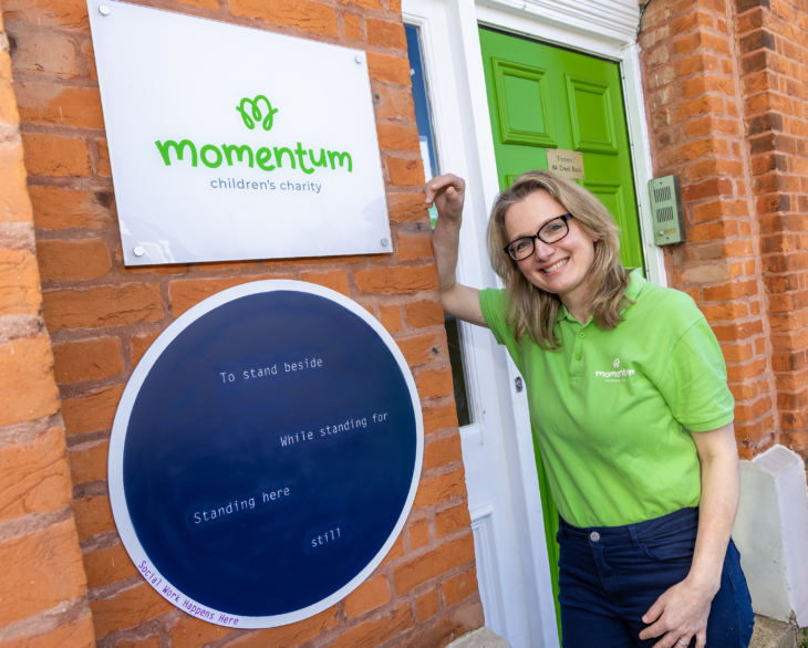 Hana, Social Worker at Momentum Children's Charity with new artwork