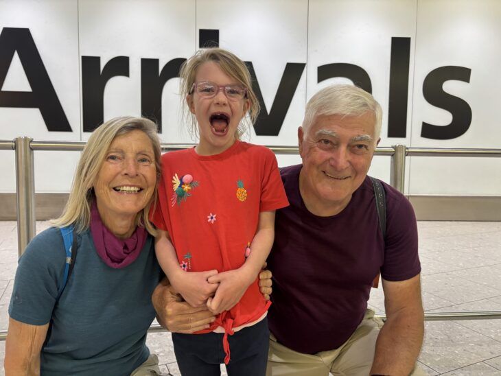Grandparents are reunited with their granddaughter at Heathrow Airport