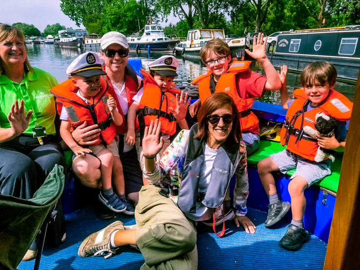 A Momentum supported family aboard the charity's riverboat with Family Support Worker