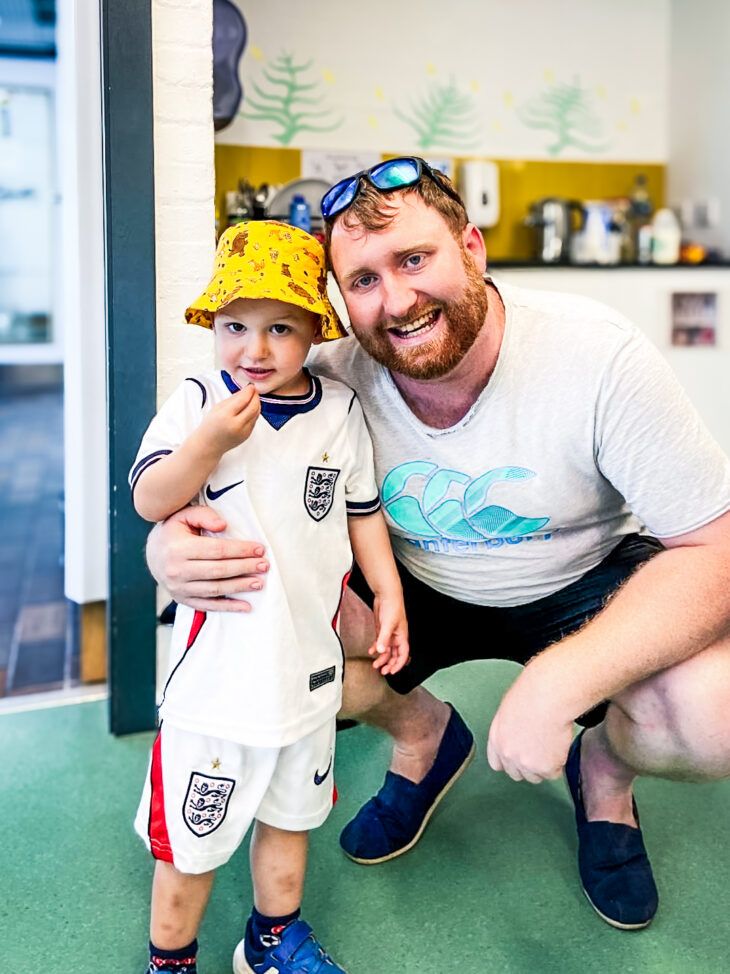 A father and son smile as they enjoy a day at London Zoo, organised my Momentum Echoes.