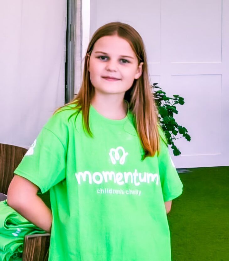A Momentum Young Ambassador in her charity t-shirt